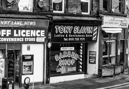 A black and white photo of a barber shop