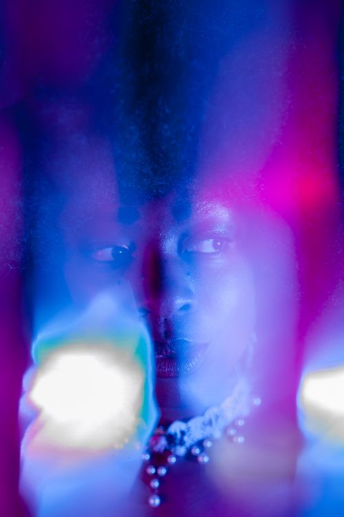 Free Creative portrait of a woman with neon lights, capturing a vibrant nightlife essence in Berlin. Stock Photo