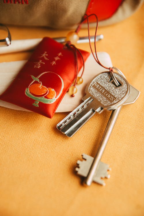 A key chain with a key and a bag