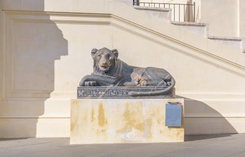 A statue of a lion on a pedestal