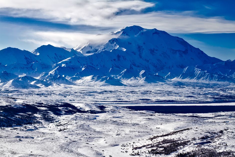 Anchorage Prince William Sound Heli Tour with Glacier Landing - Breathtaking view of a snow-covered mountain range under a clear blue sky in Alaska.