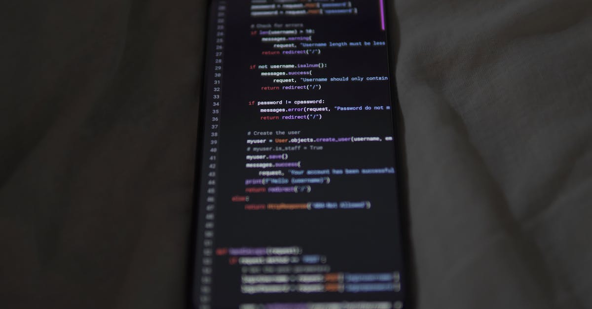 Close-up of a smartphone showing Python code on the display, showcasing coding and technology.
