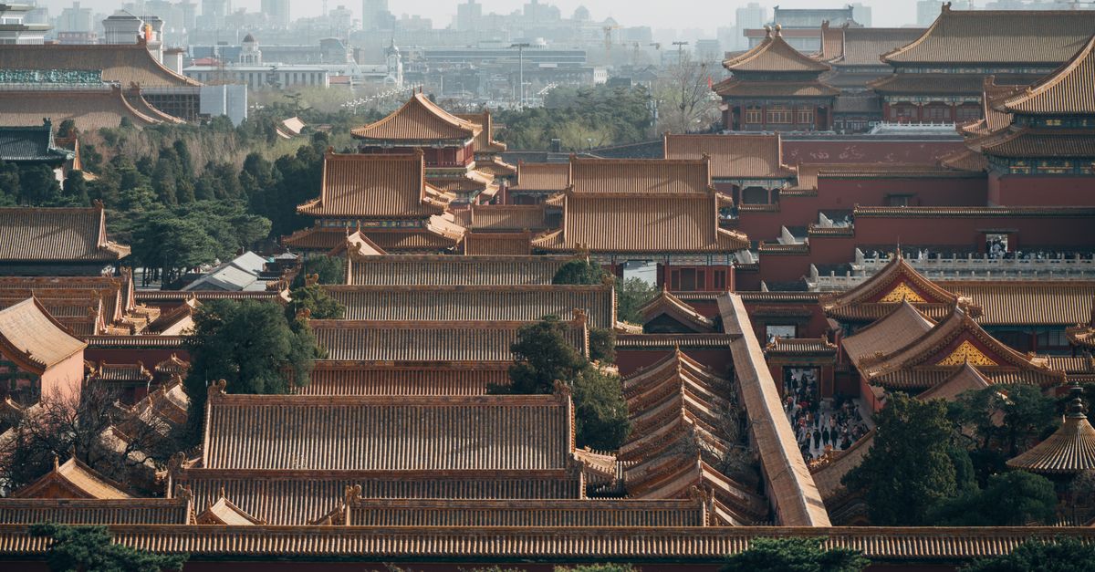 Explore an aerial view of Beijing's Forbidden City showcasing traditional Chinese architecture.