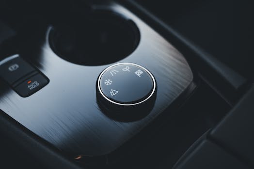 Detailed view of an SUV's sleek and modern center console dial for driving modes.