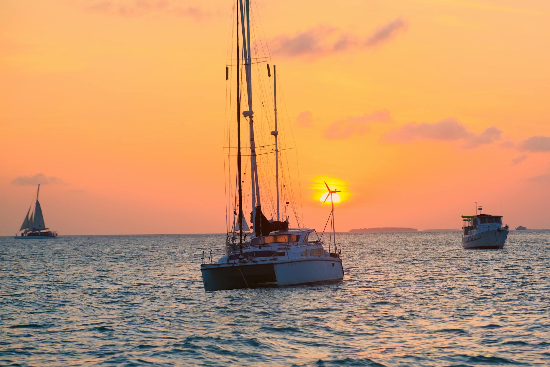 Peaceful sunset scene of sailboats in Key West waters, Florida.