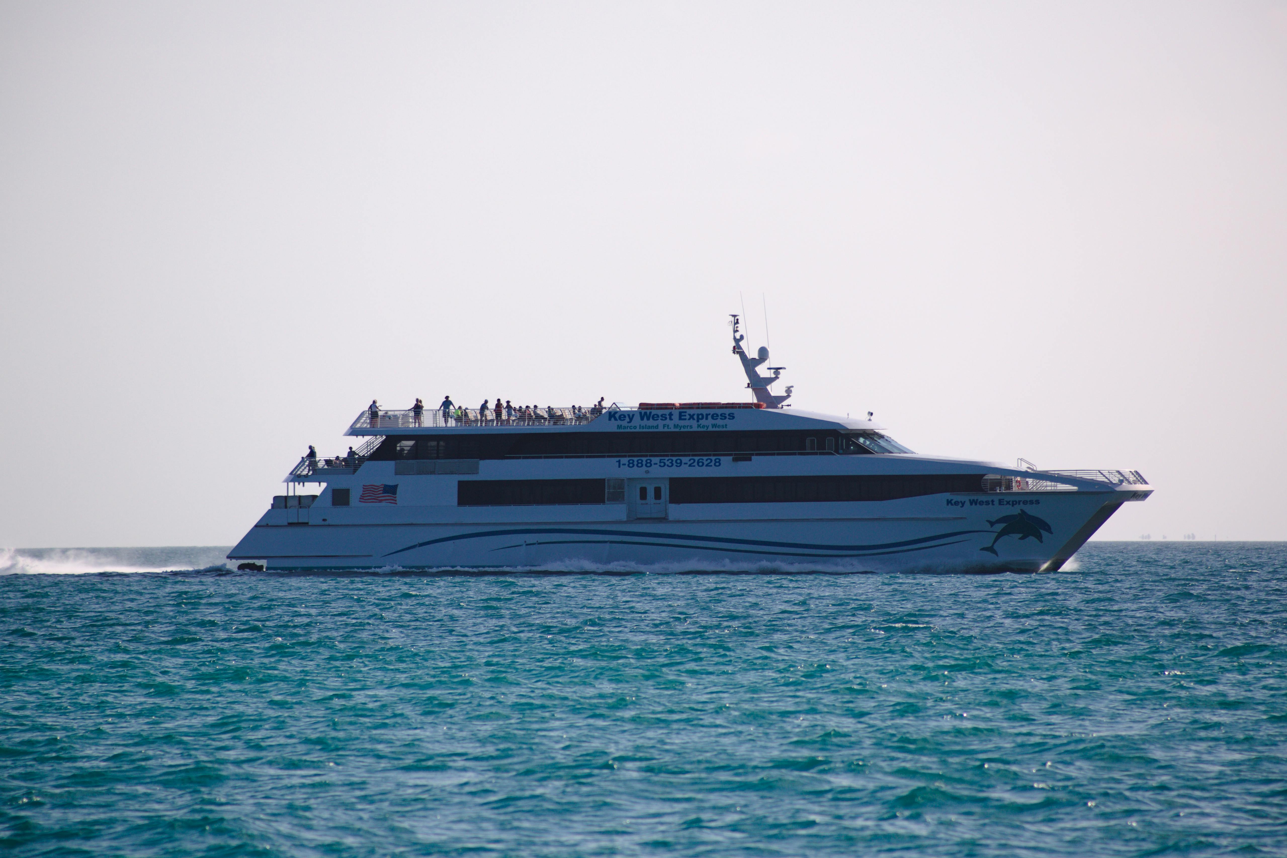 a large white boat traveling on the ocean