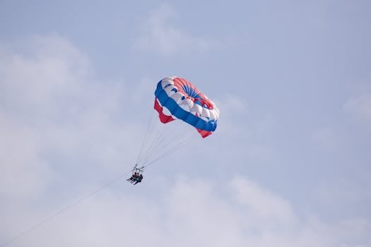 Experience the thrill of parasailing over the clear blue skies of Key West, Florida.