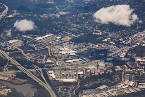 An aerial view of a city with clouds and buildings