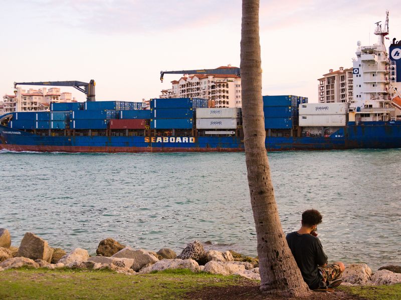 freight forwarder reviewing LCL cargo documentation in Miami warehouse