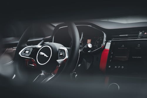 The interior of a red and black sports car