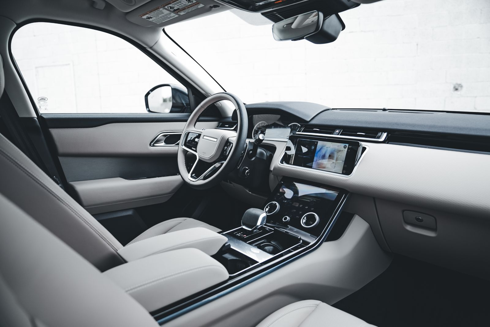 Cleaned dashboard, steering wheel, and center console inside a luxury SUV after a professional interior detail