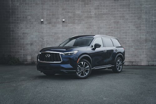 The front end of a blue infiniti suv
