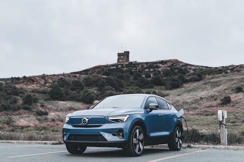 The volkswagen suv parked in front of a mountain