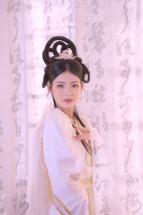 Free Portrait of an Asian woman in traditional clothing with intricate hairstyle. Stock Photo