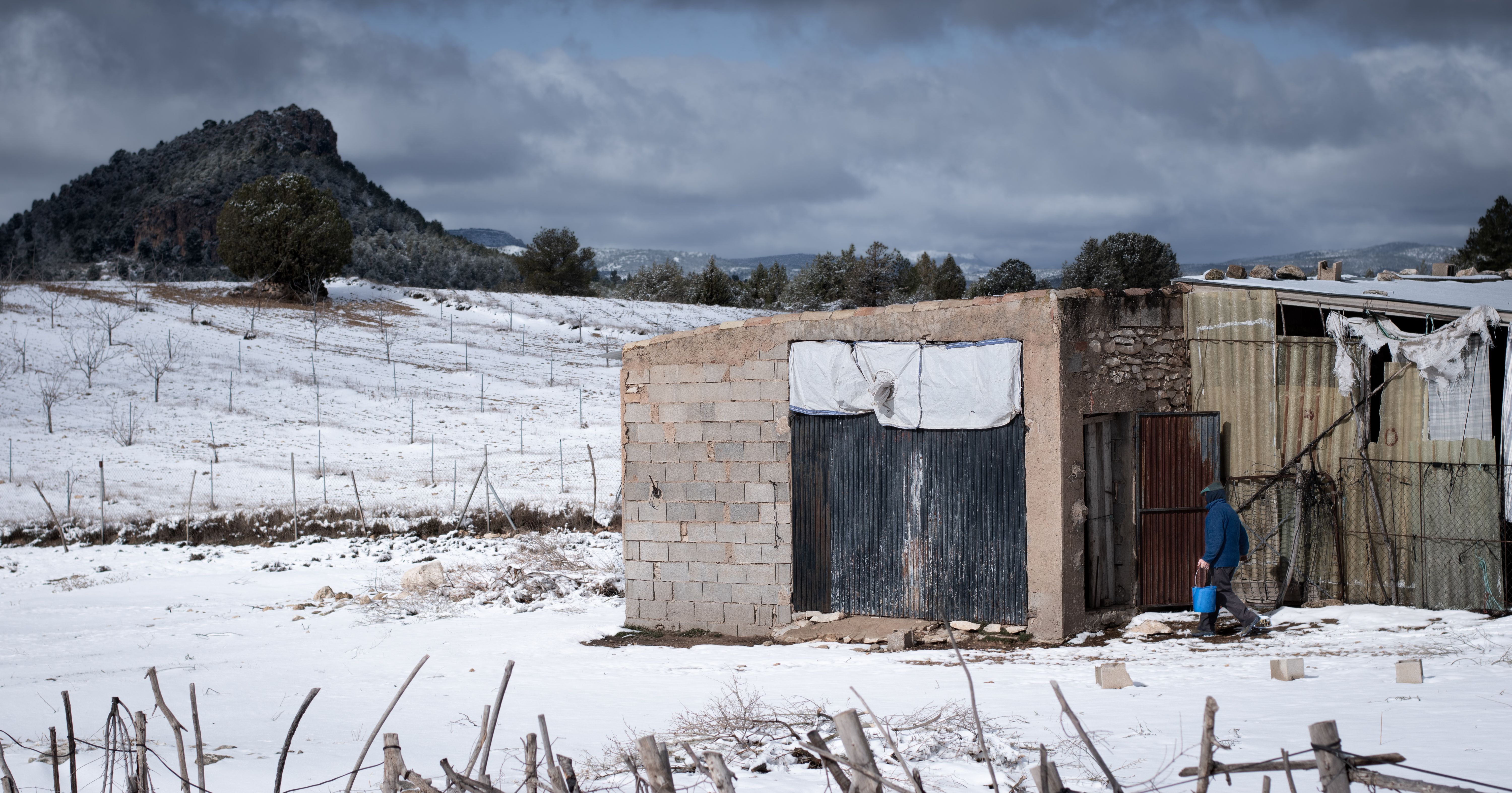 Person Walking into an Abandoned Home · Free Stock Photo