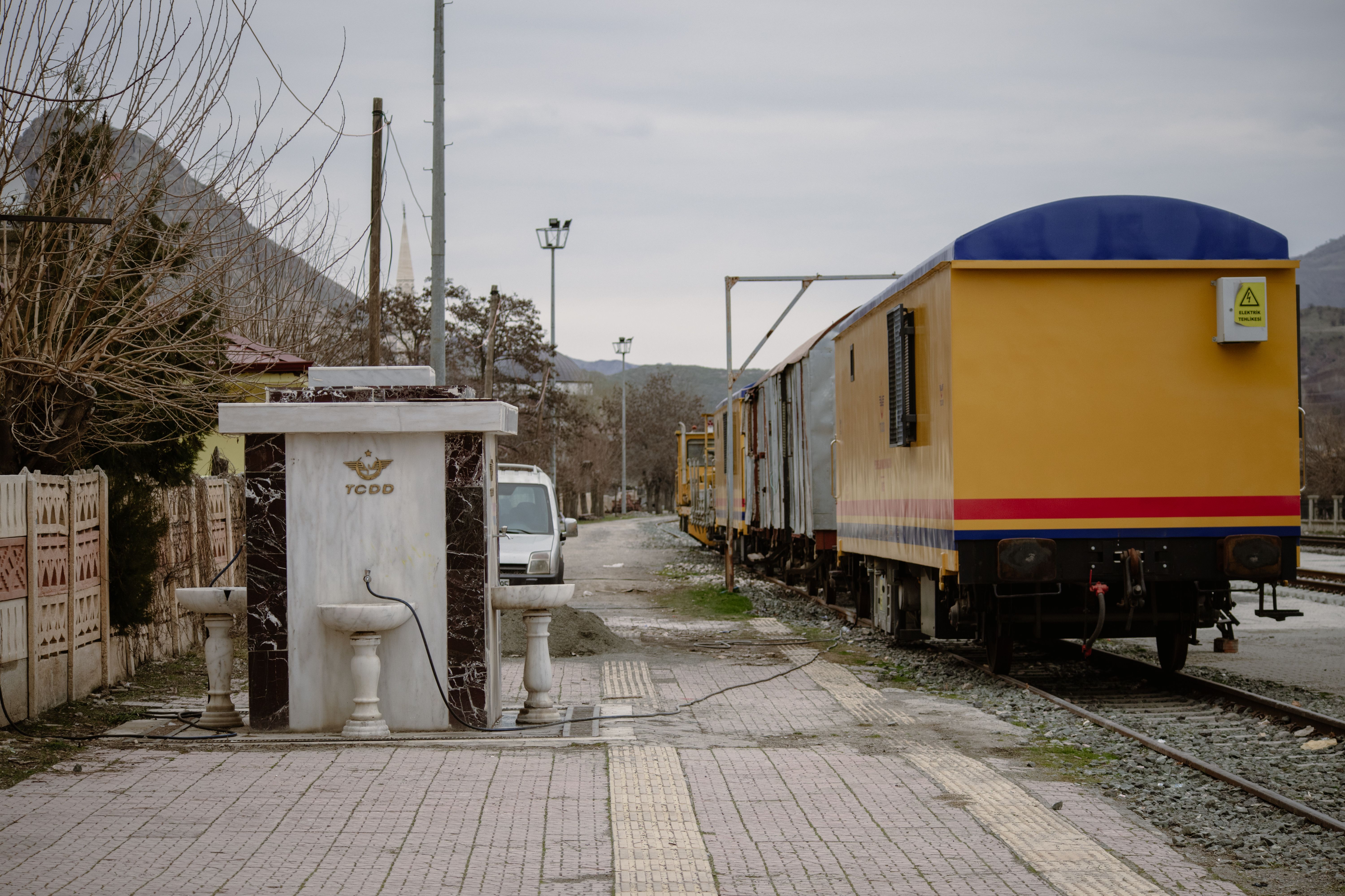 A work train at a railway station in Palu, Turkey with TCDD signage visible. (Photo by Zülfü Demir📸 on Pexels)