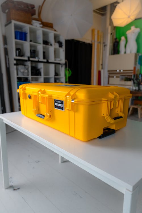 A yellow case sitting on top of a table