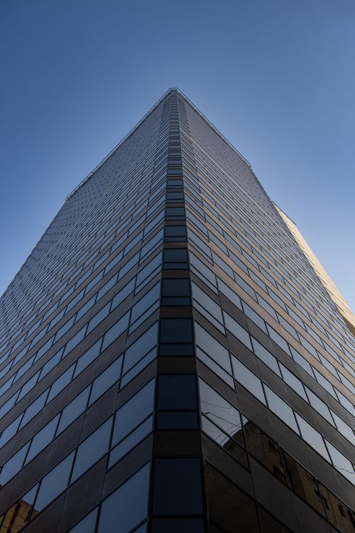 Free Low angle view of a modern office building skyscraper in Buenos Aires, Argentina under a clear blue sky. Stock Photo