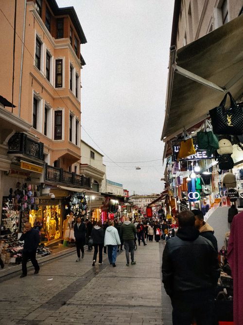 Free Vibrant street scene in Istanbul showcasing bustling activity with shops and people. Stock Photo