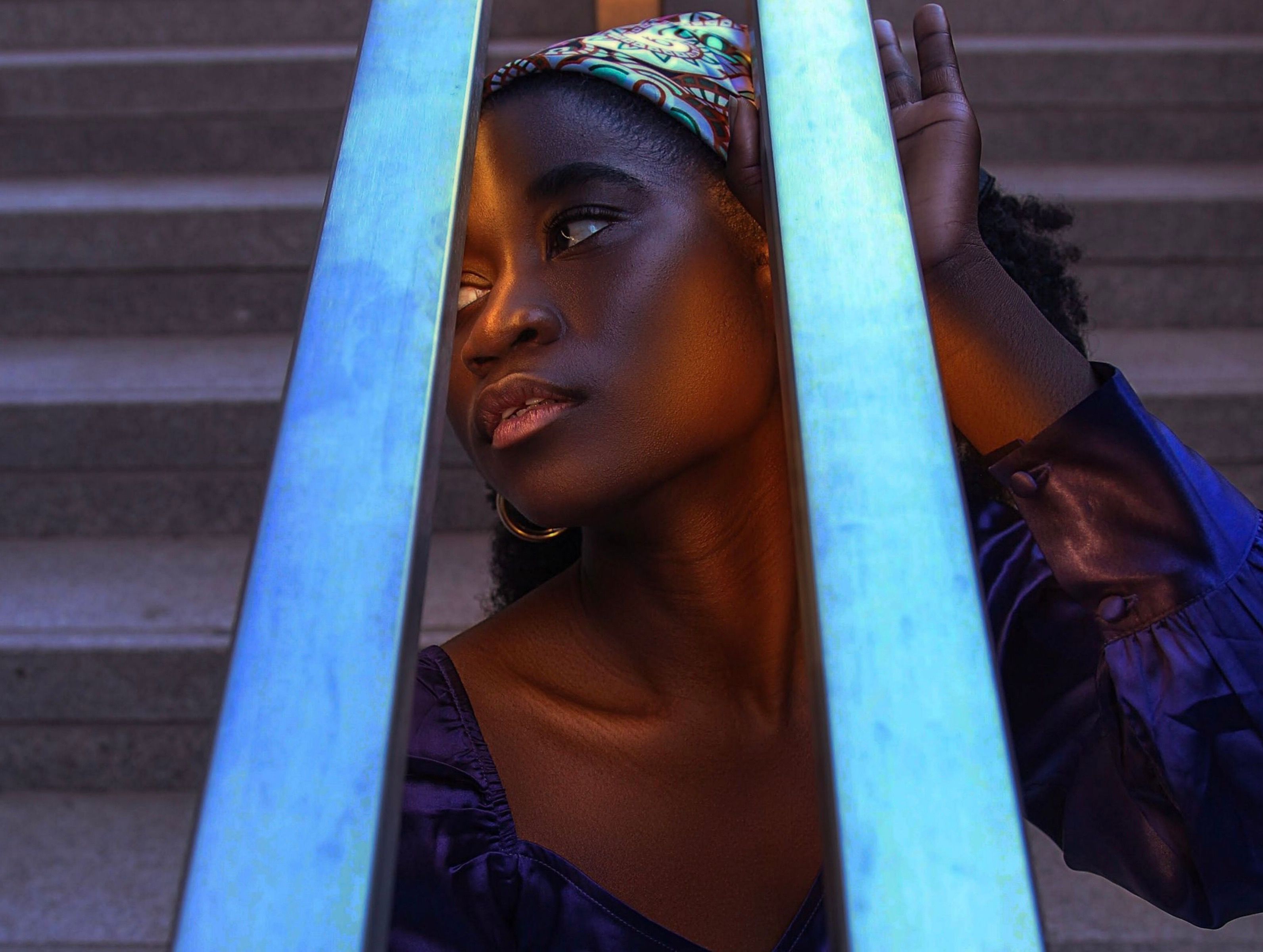 Woman Sitting under Handrail Bars · Free Stock Photo