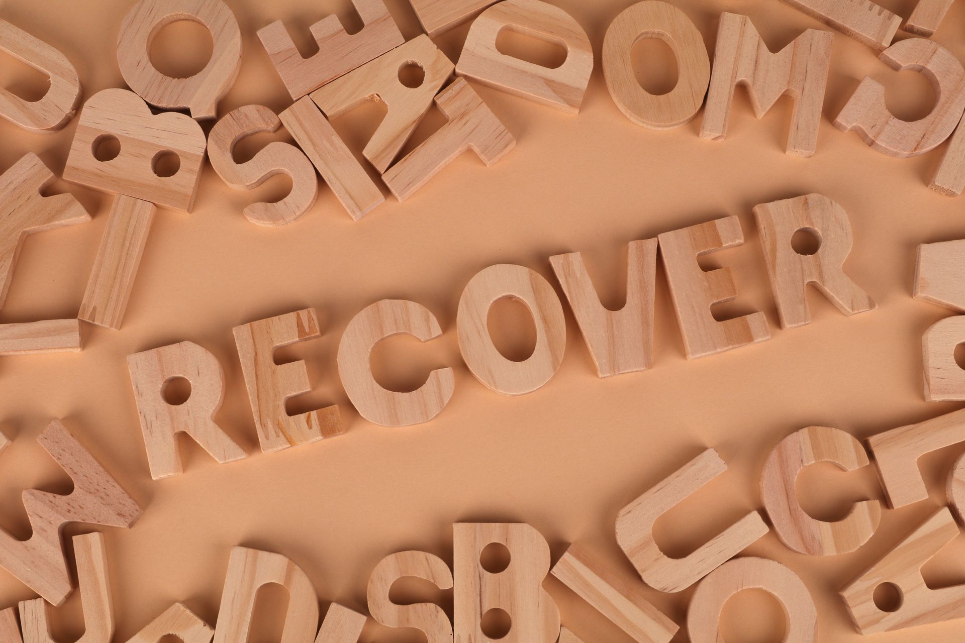 Word Recover Made up of Wooden Letters
