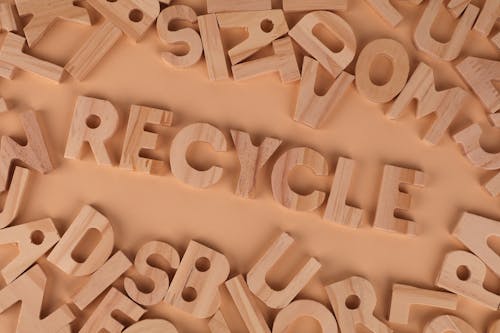 The word recycle in wooden letters