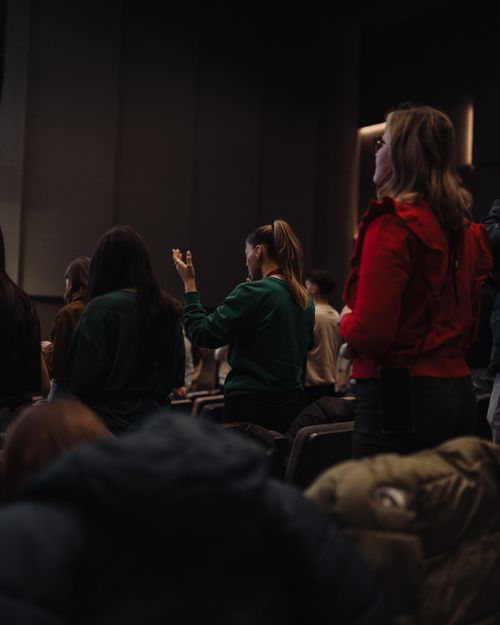 Free A diverse group of adults standing in devotion during an indoor worship service in Oradea, Romania. Stock Photo