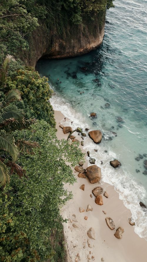 Free A stunning aerial view of Puerto Vallarta's beach with lush cliffs and turquoise waters. Stock Photo