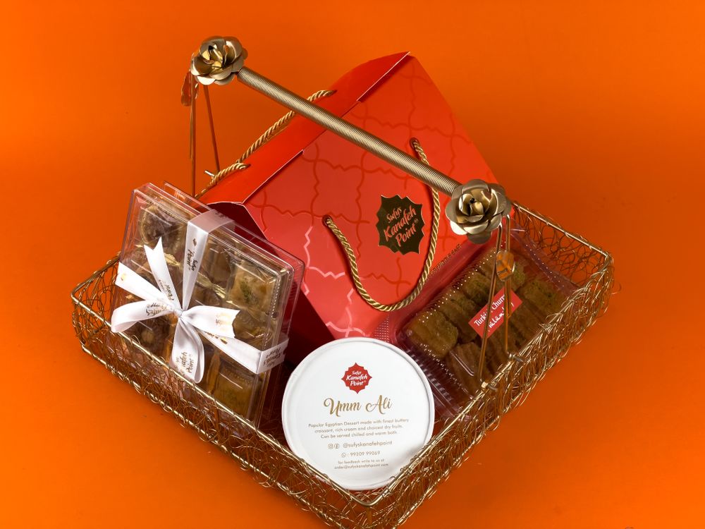Luxurious corporate gift basket with chocolates, sweets, and pralines for the holidays
