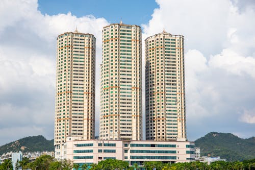 Free View of Modern Residential Skyscrapers on the Background of Mountains  Stock Photo