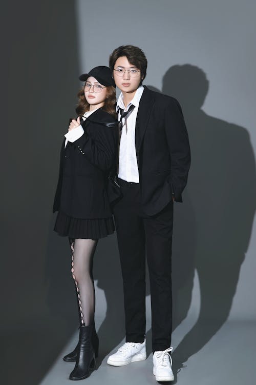 A man and woman in black and white clothing