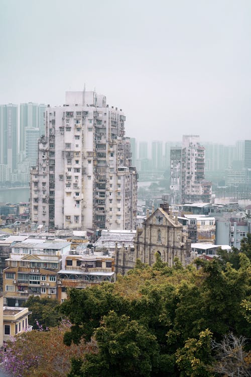 A city with tall buildings and trees in the background