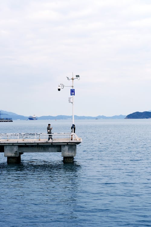 Photos gratuites de côte, homme, jetée