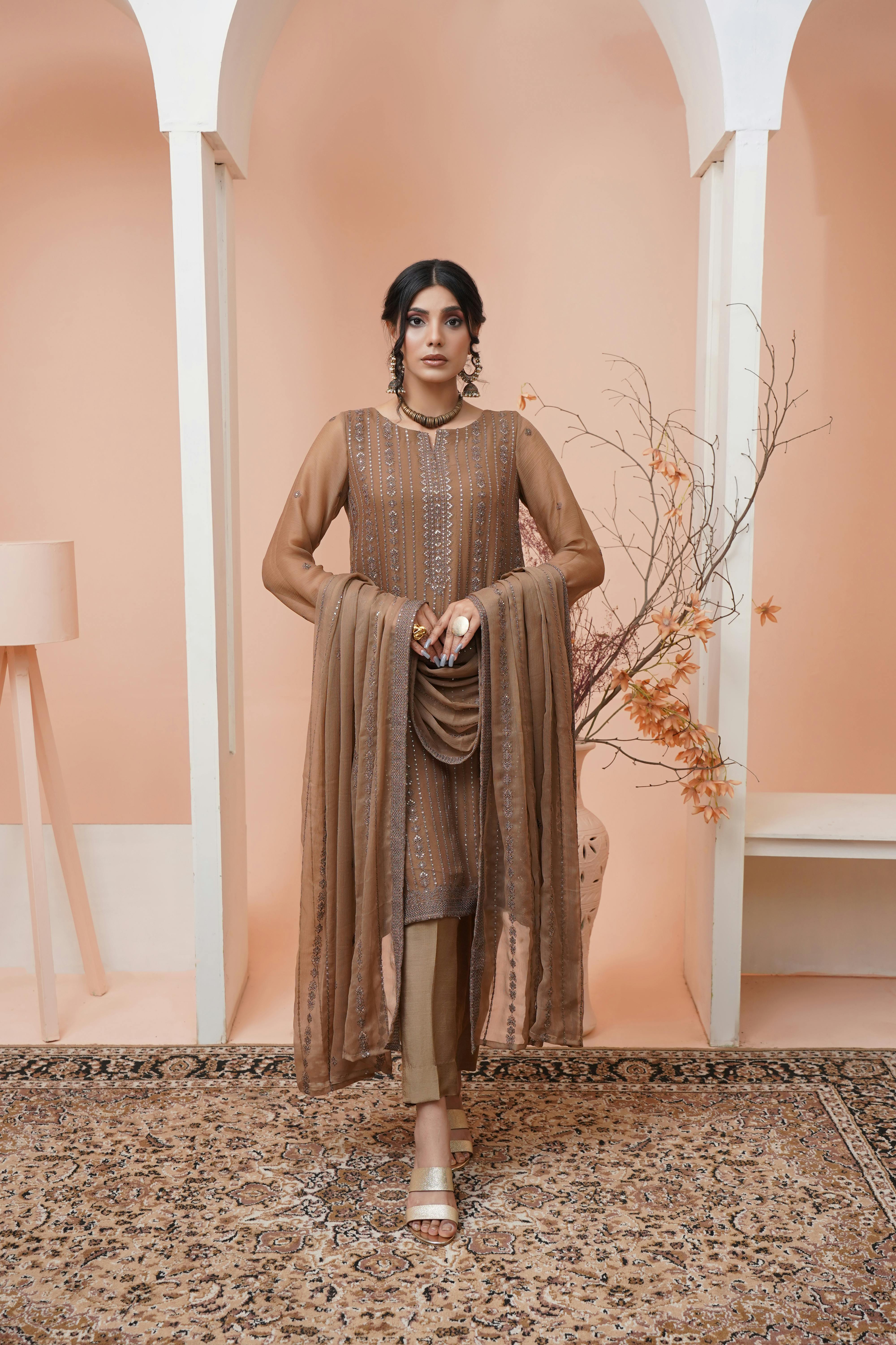 elegant woman in a traditional dress with embroidery