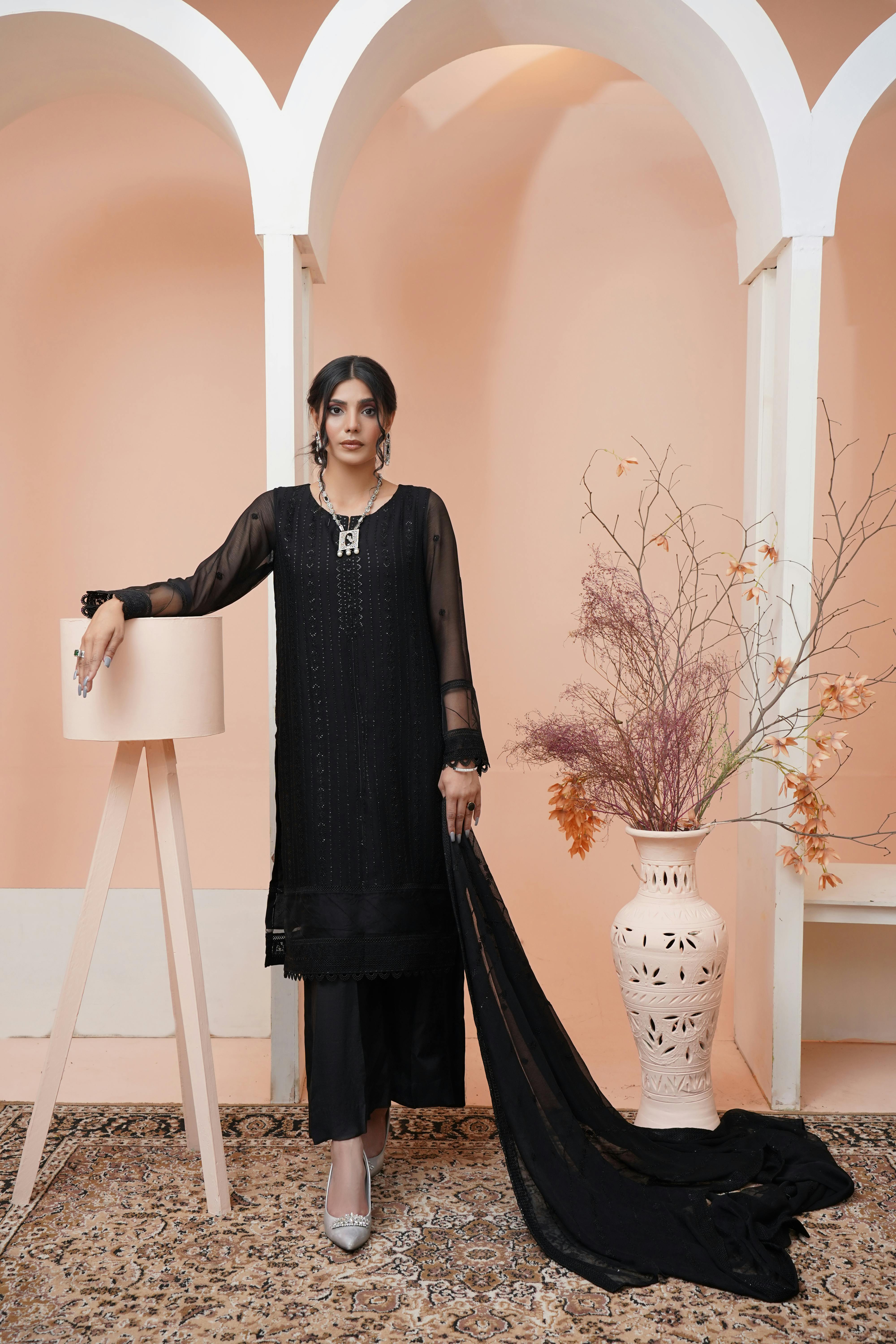 elegant woman in black traditional clothing and heels