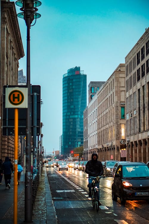 A person riding a bike down a city street