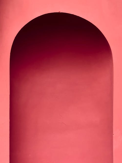 A red archway with a pink background