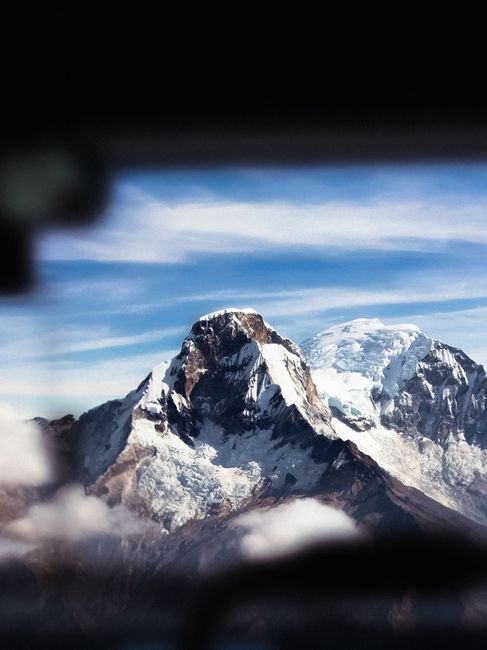 Stunning snow-capped mountain peak against a clear blue sky, offering a breathtaking view.