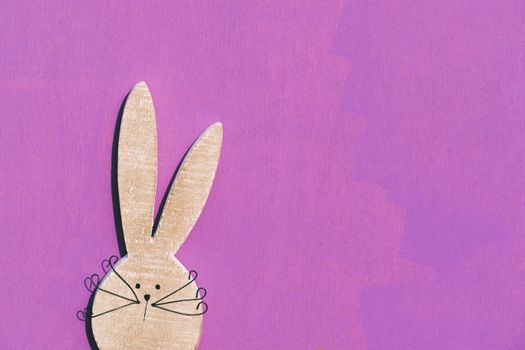 Playful bunny illustration with large ears on a vivid pink backdrop, perfect for decorations.