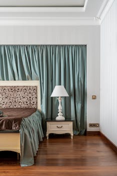 Luxurious bedroom showcasing elegant decor with a classic touch, featuring a wooden floor.