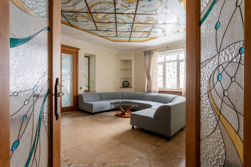 A living room with a glass ceiling and a couch