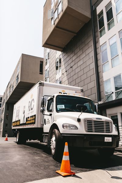 Truck parked outside a building for a job