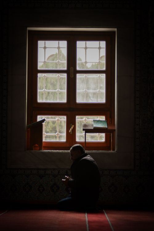 Free A man praying in a mosque in Ankara, Türkiye, illustrating devotion and spirituality. Stock Photo
