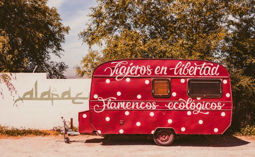 A camper trailer with the words tatou's at a campground