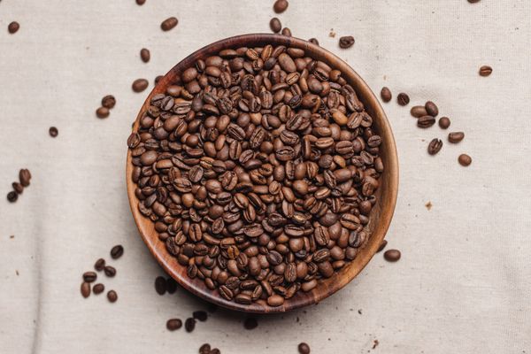 Roasted coffee beans in a wooden bowl — K on Pexels