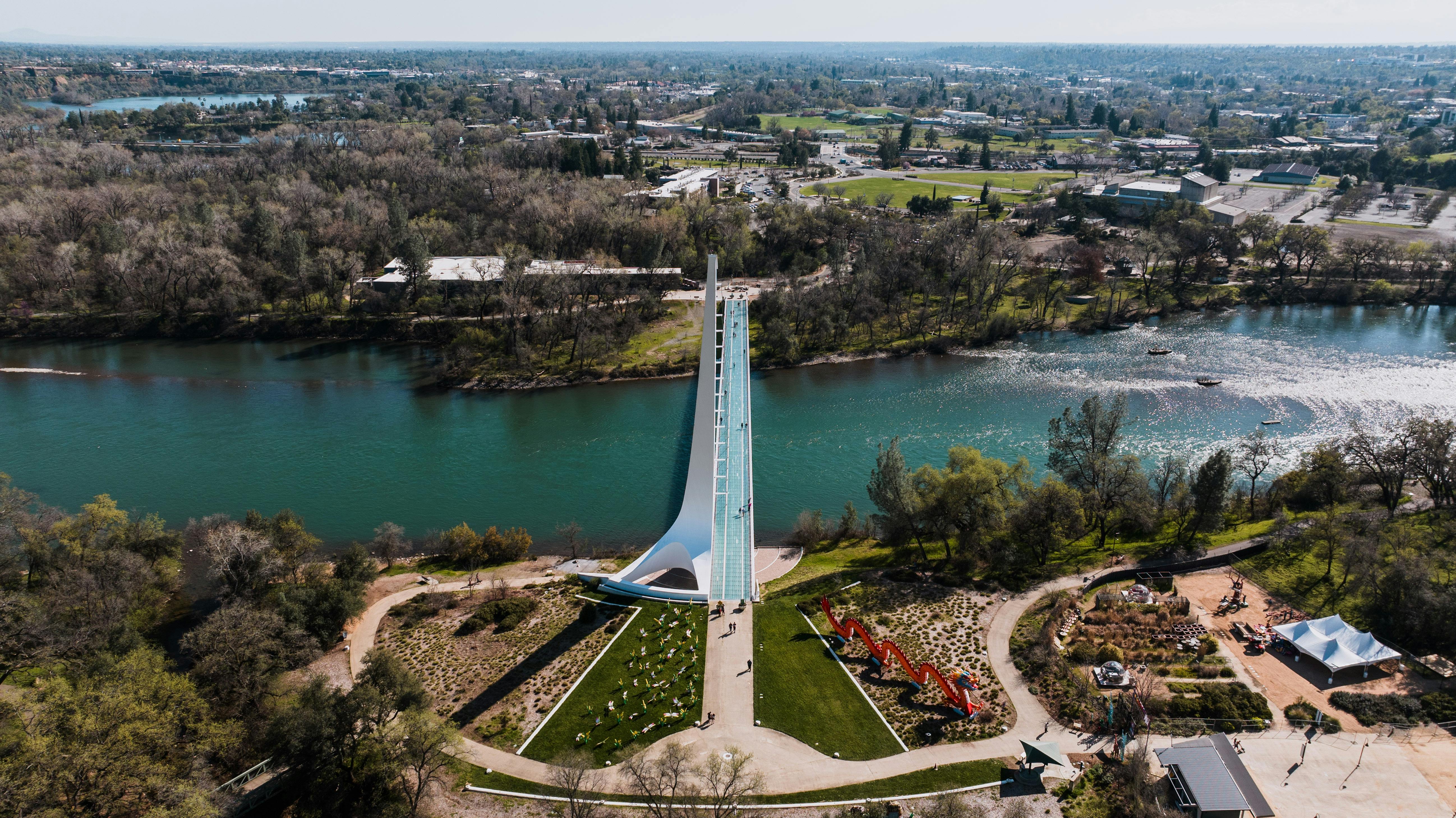 Stunning aerial shot of Sundial Bridge crossing the Sacramento River in Redding, California.
