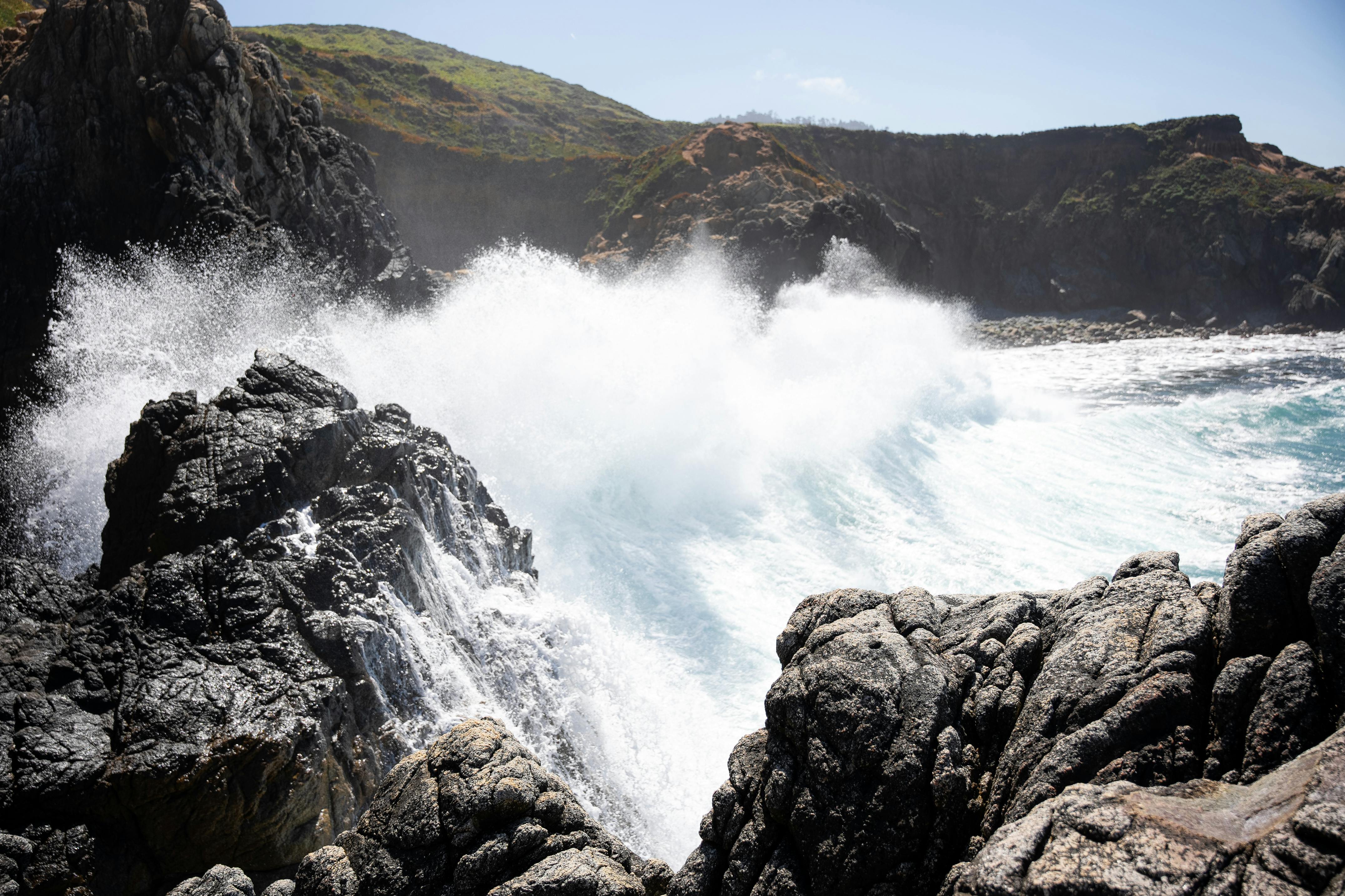 wave splashing against a rocky coast