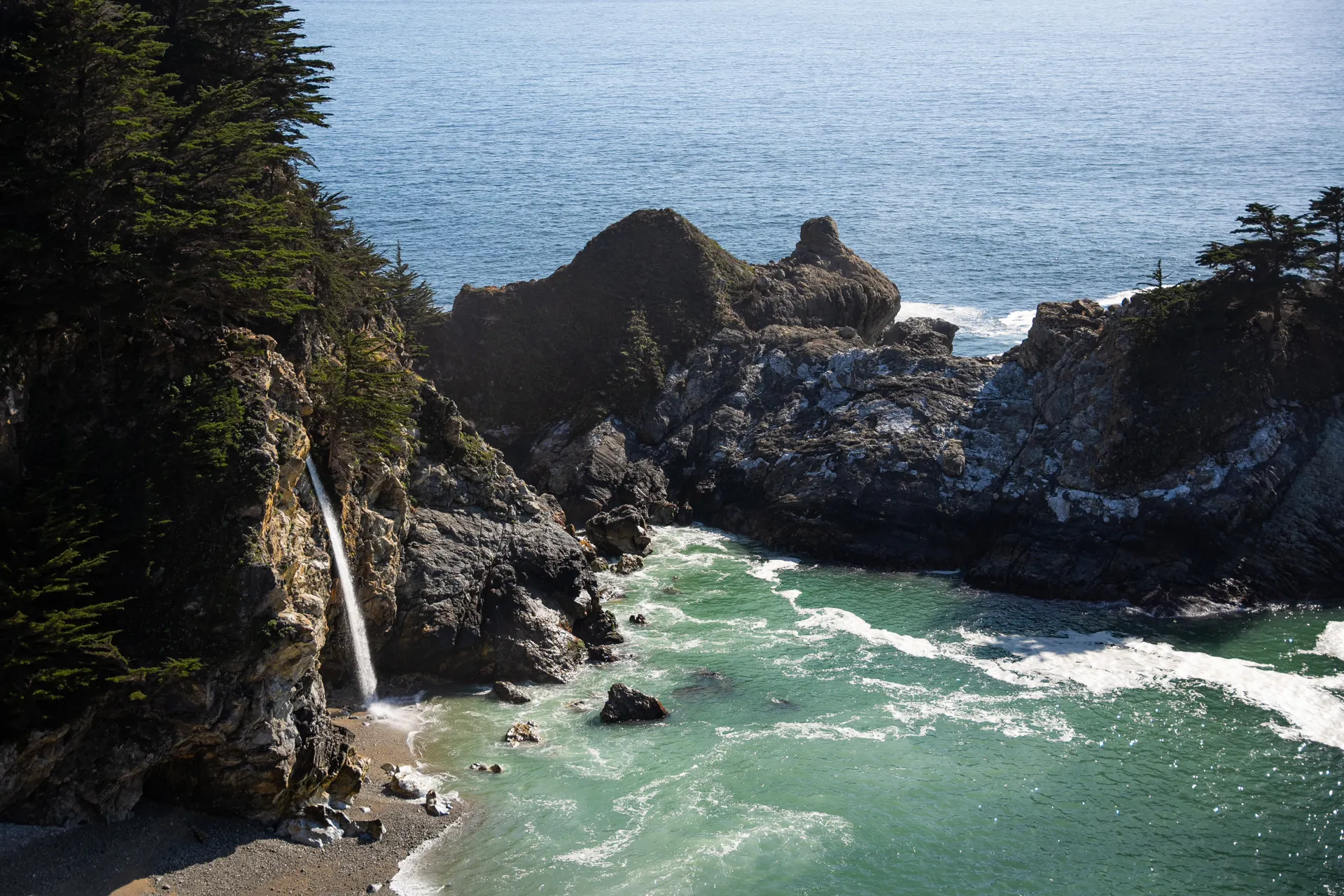 A cove backed by cliffs on the Big Sur coast in California A cove backed by cliffs on the Big Sur coast in California