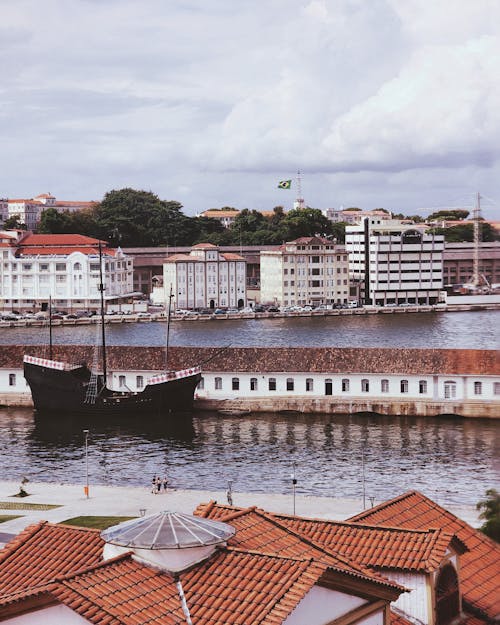 A view of the city with a boat in the water