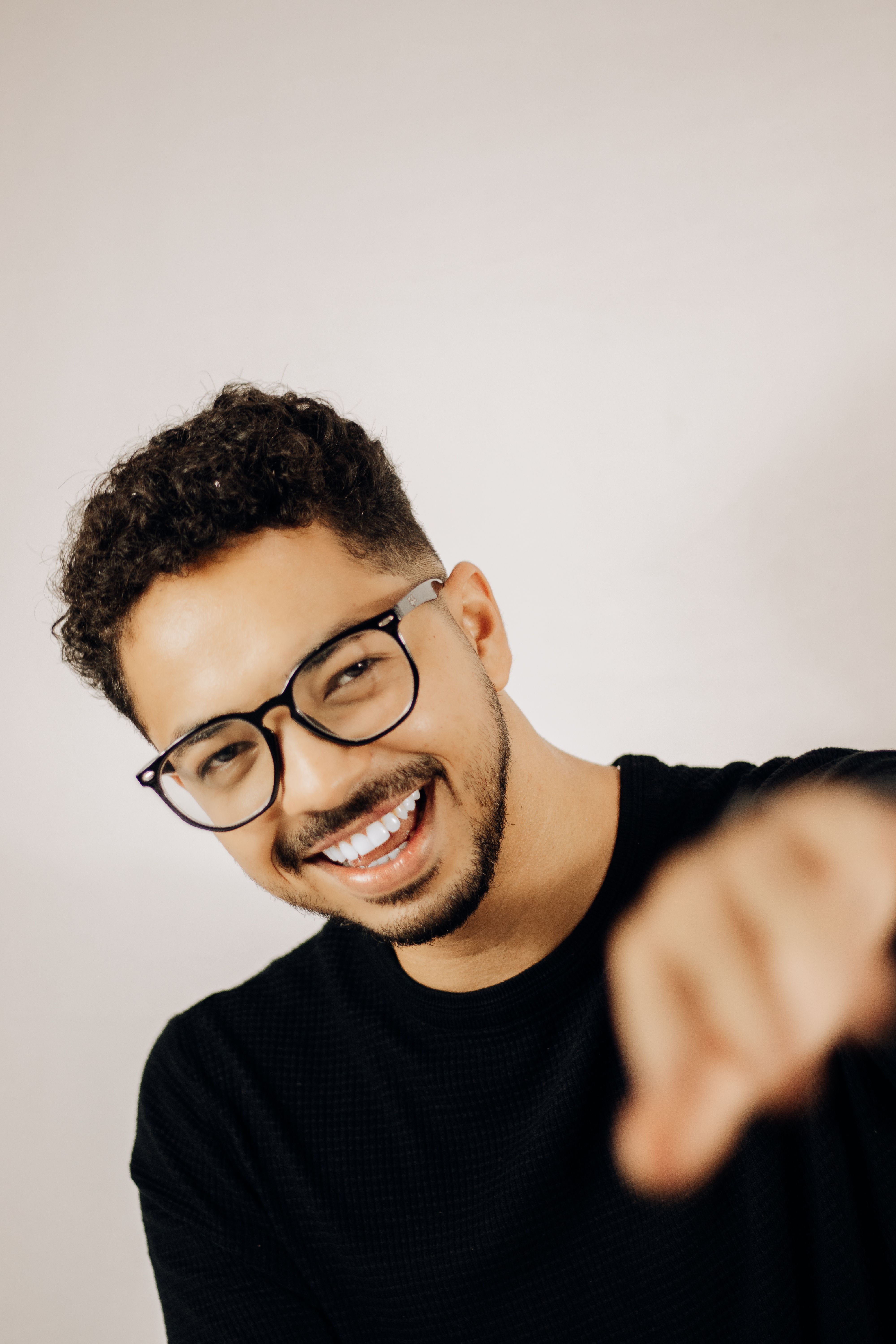 Portrait of a Young Man Smiling at the Camera · Free Stock Photo